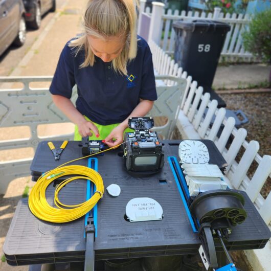 Woman technician at SDU Telecoms performing fibre splicing