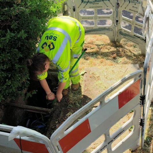Woman engineer at SDU Telecoms working on-site.