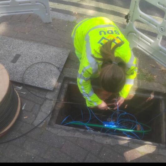 Woman engineer at SDU Telecoms working on-site